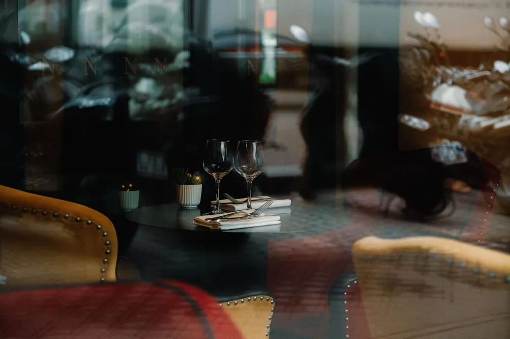 Elegant Savorian private dining room with warm ambient lighting and refined table settings